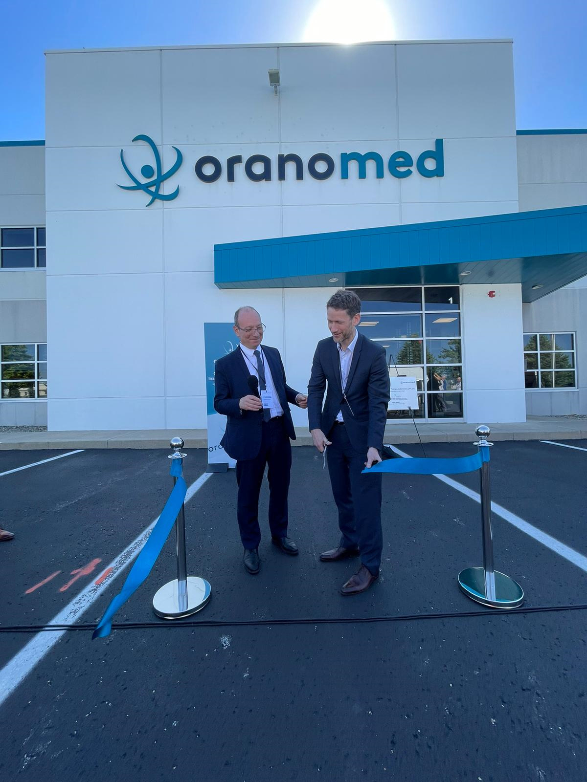 Dureau and Dodet cut the ribbon to open the new ATLab Indianapolis facility.